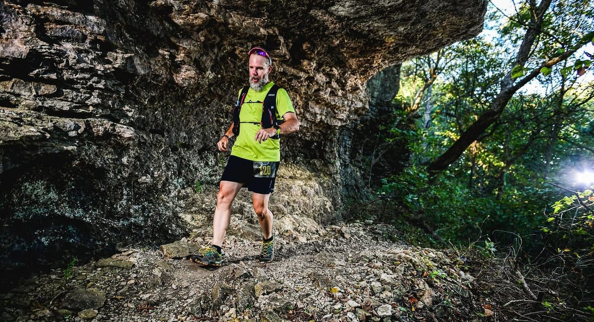 Matt running over a rocky ledge at the Flatrock 20K in Independence, KS.